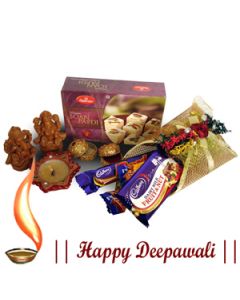 250 Soan Papdi with 5 assorted Chocolates in Beautifully decorated pack, Traditional wax diya with earthern Lakshmi-Ganesha.