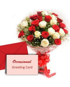 Bunch of red and white roses and a greeting card