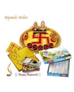 A Designer Puja Thali, Ganesh Laxmi idols and Diwali Diyas, 1/2 Kg. Kaju Burfee from Haldirams, Pleasure of Cadbury Celebrations 246 gms & 250 gms mixed dry fruits in a gift box with Deepawali message.