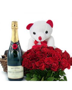 Hamper of a branded Champagne bottle along with a bunch of 18 red roses n a teddy bear.