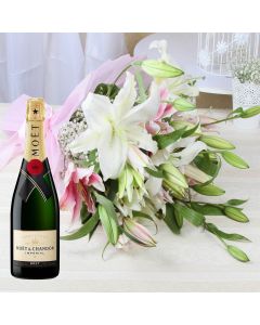 A Imported Moet & Chandon Champagne with Bunch of 10 Mix Pink and White Lilies in a Tissue Paper with matching wrapping and ribbon bow tied.