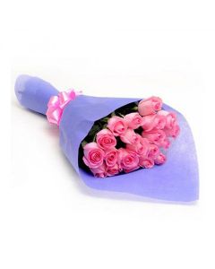 Bouquet of 20 pink roses arranged in a crisp blue paper