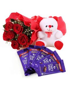 Sweet Surprise - Bunch of 12 red roses with 6" teddy bear and Cadburys Dairy Milk Chocolates Combo Gift